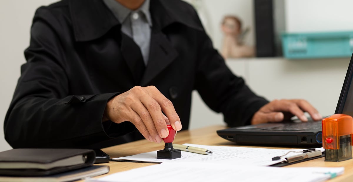 document stamping approved, business man stamping on document